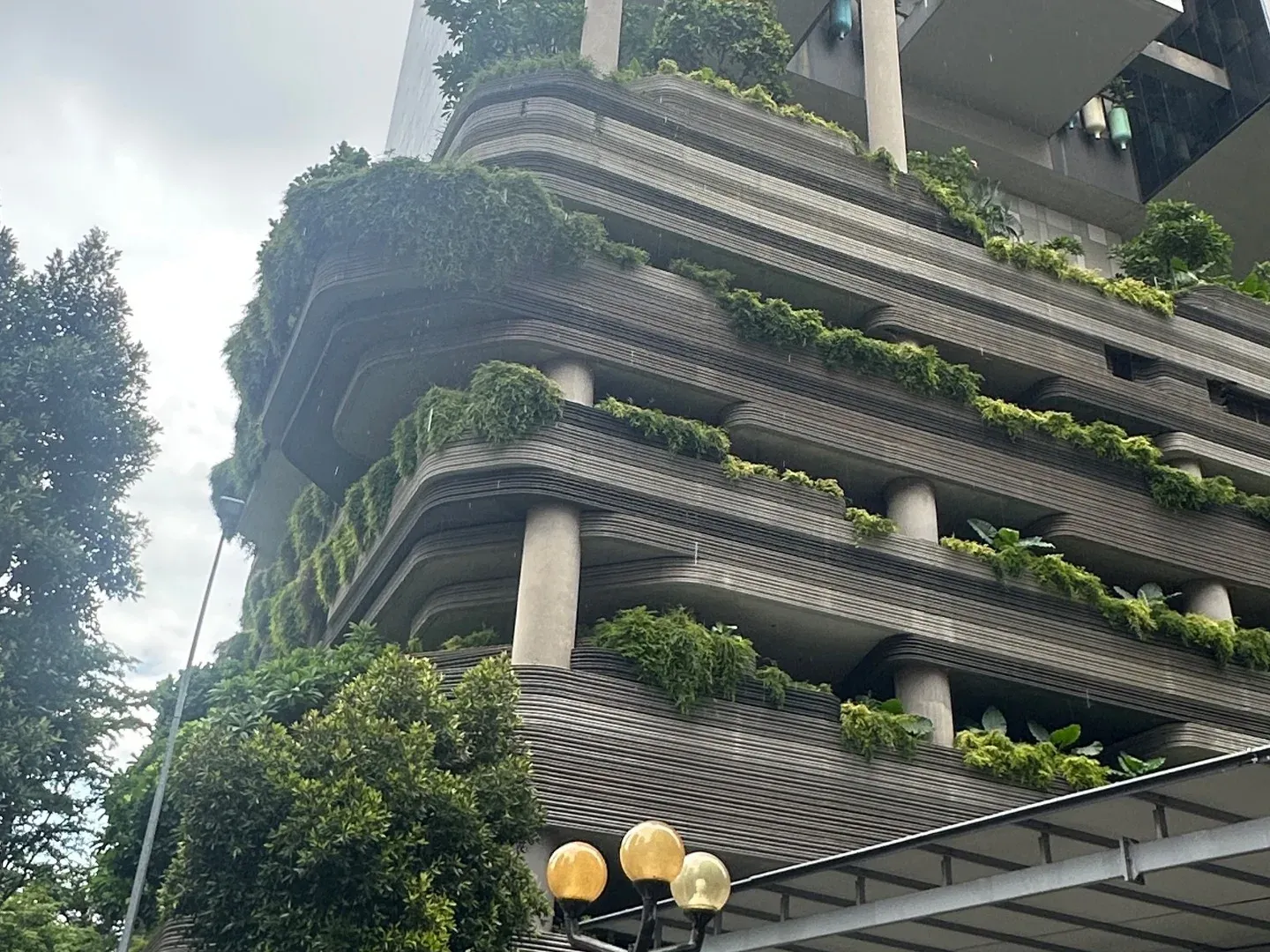 A tower with terraces covered in plants, Singapore