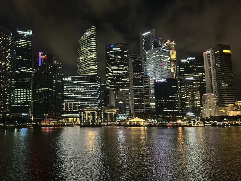 Singapore skyline reflected in Marina Bay at night