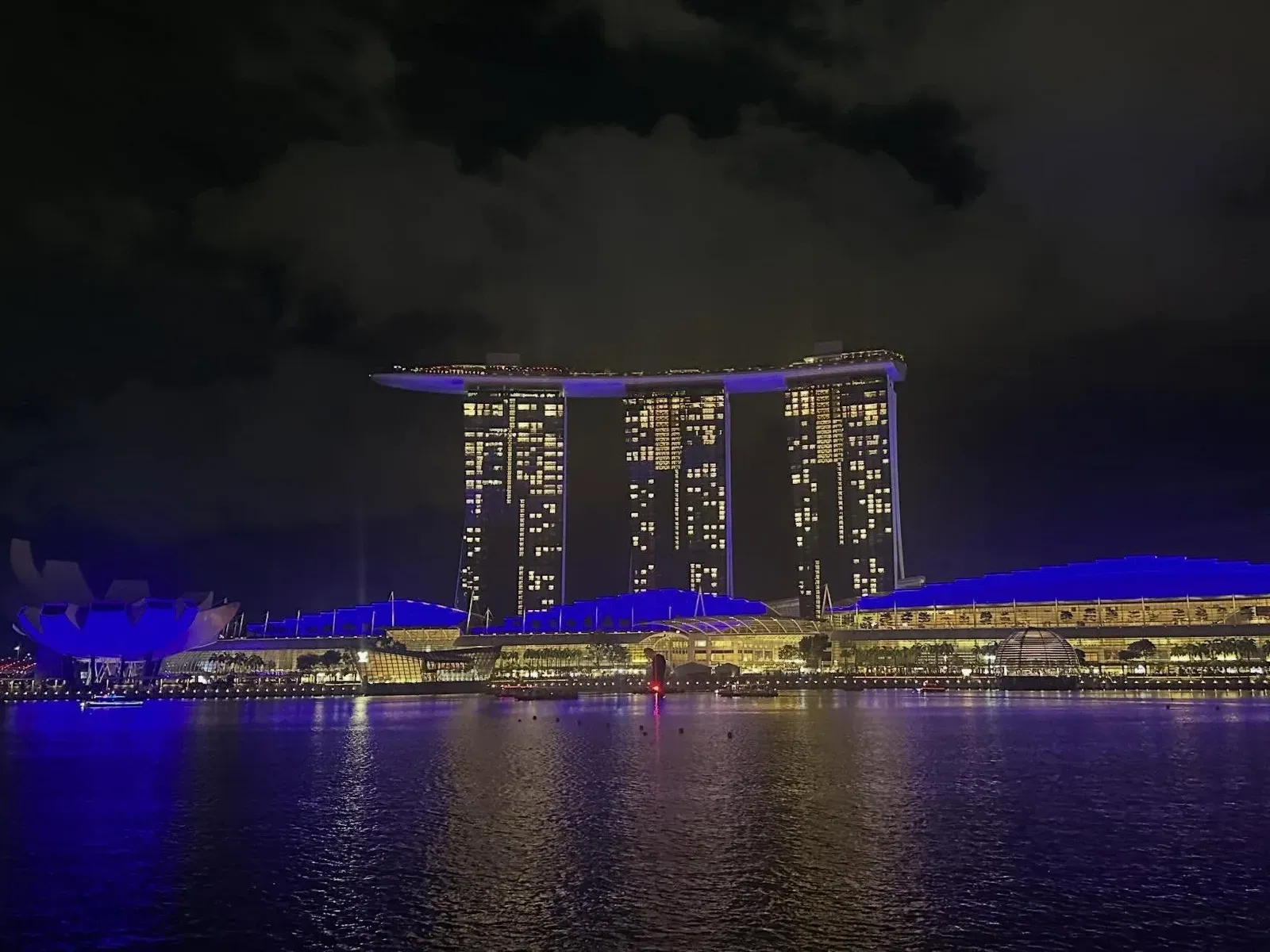 Marina Bay Sands lit up across the water at night
