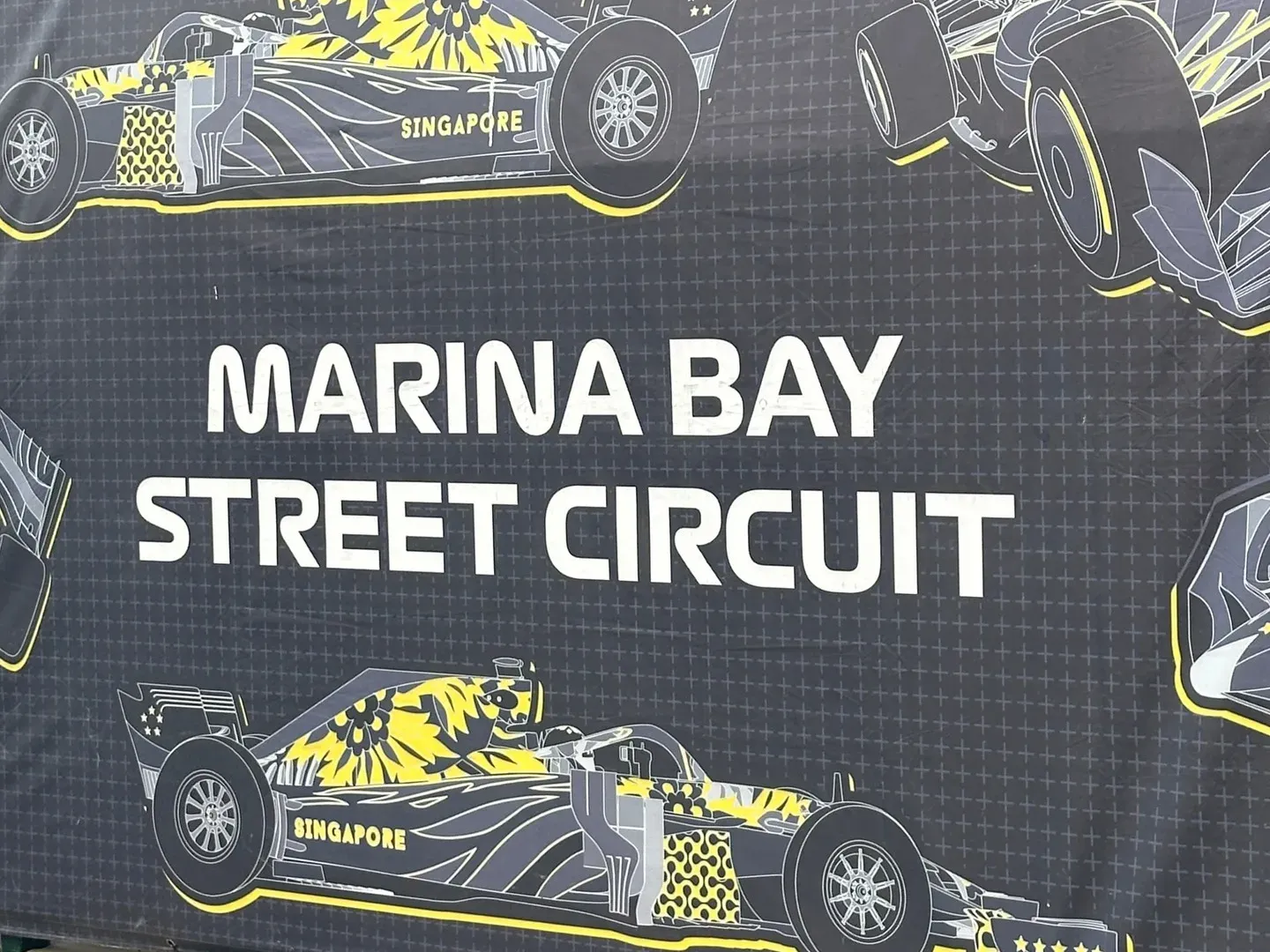 Banner for the Marina Bay Street Circuit with drawings of F1 cars