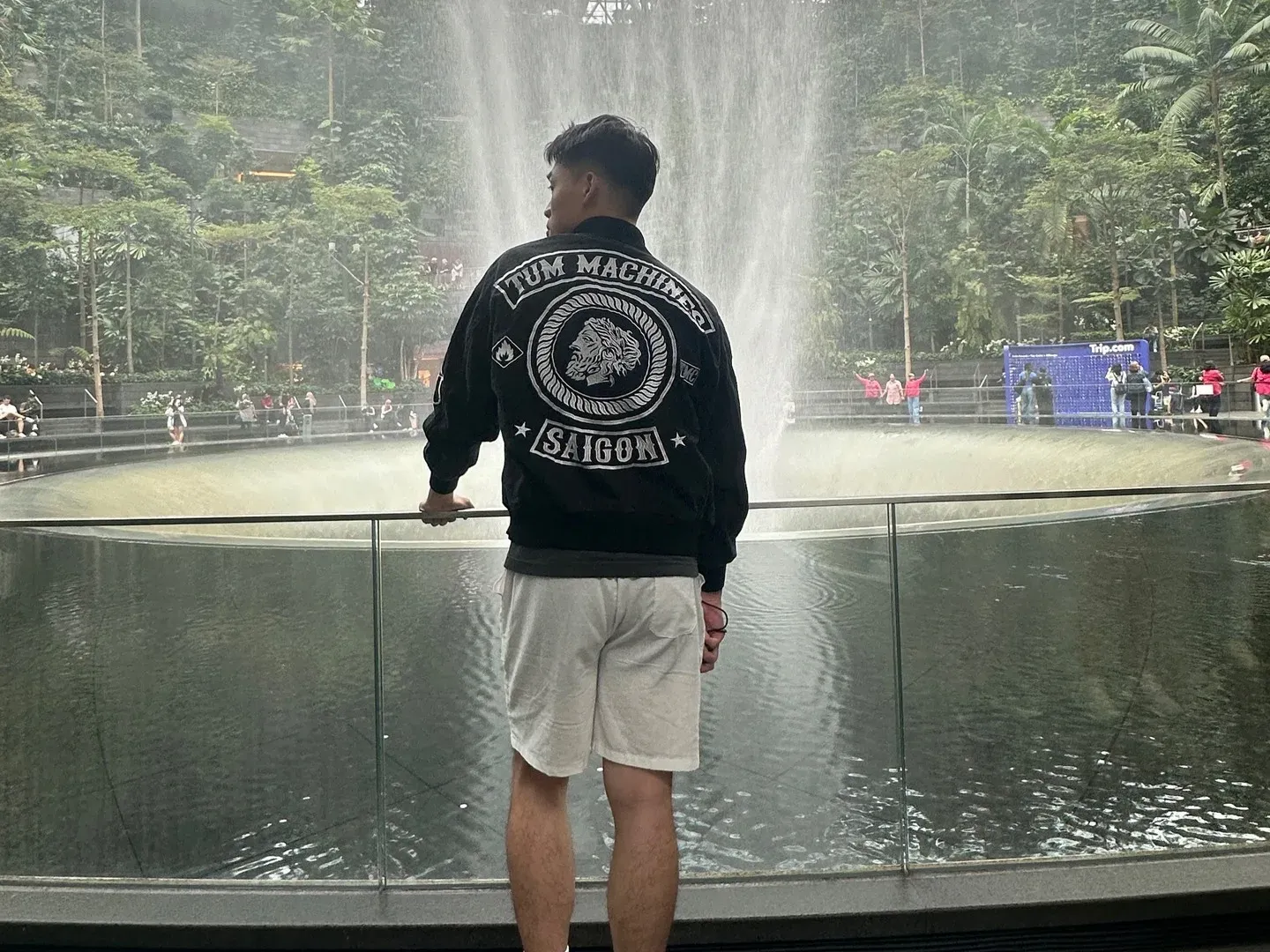 Thái Lý An watching the indoor waterfall at Jewel Changi