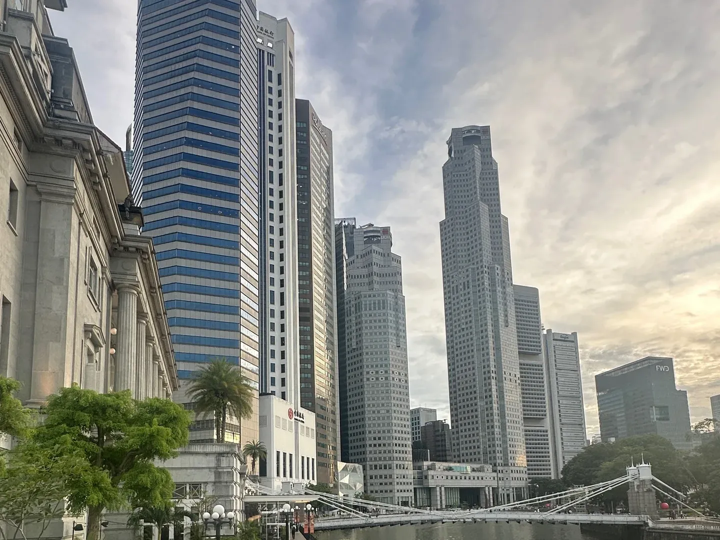 Singapore River with office towers on a cloudy day